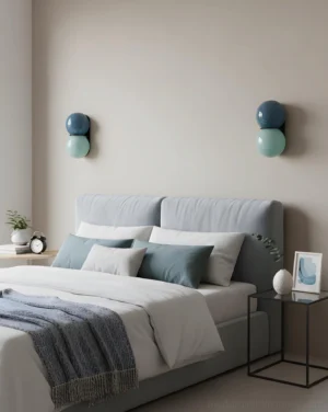 Twin Twinwave double globe wall sconces installed in modern Nordic bedroom beside bed with neutral decor