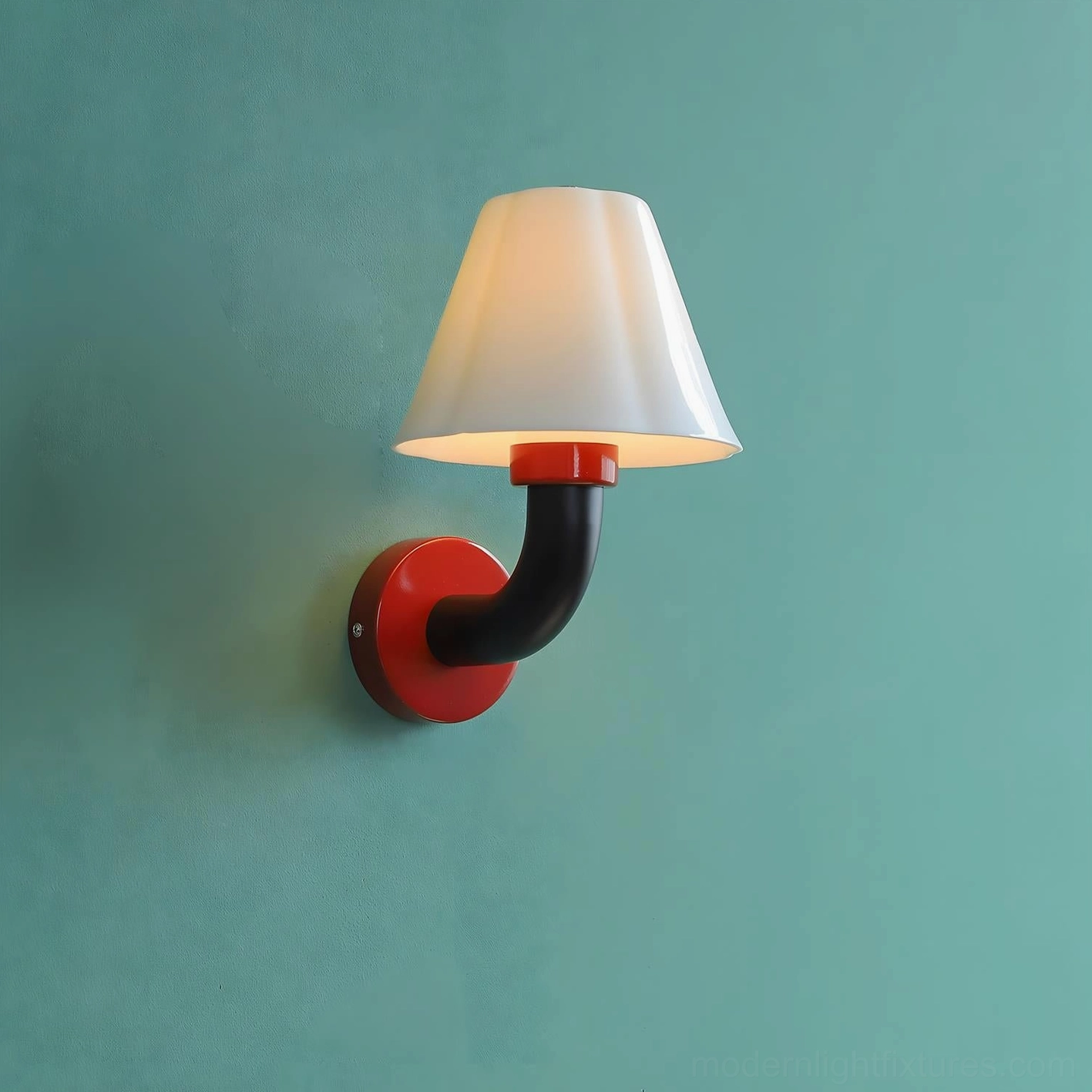 Twist Shine wall sconce with red circular mount and black curved arm mounted on teal wall background