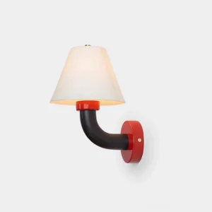 Twist Shine modern wall sconce with red base, black curved arm, and white tapered shade - front three-quarter view on studio background
