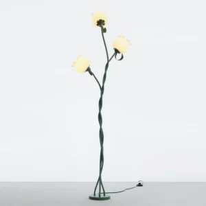 Modern Twist Tulip poseable floor lamp detail showing bell-shaped white acrylic flower shade and flexible green stem in close-up