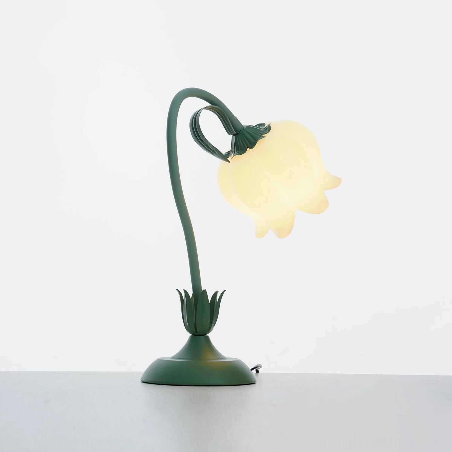 Three-quarter view of adjustable twist tulip flower lamp with extended power cord on white background