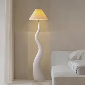 Modern twisted floor lamp in bedroom setting with warm ambient lighting and beige pleated shade