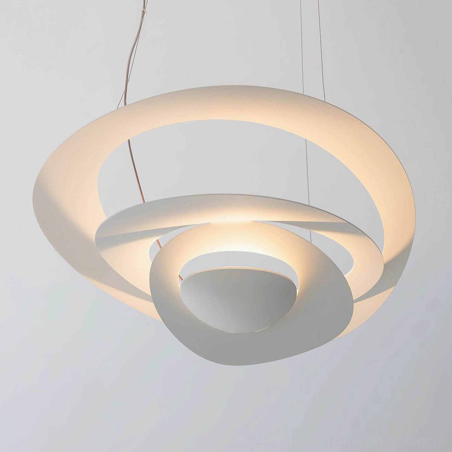 Twisted ring LED pendant in creative workspace, cool white illumination for focus and productivity