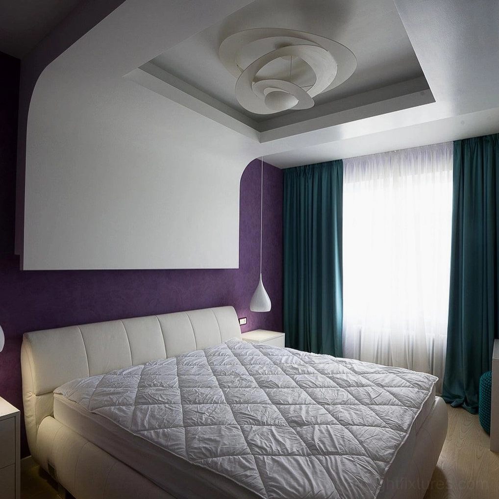 Twisted ring chandelier in luxury residential setting, sculptural modern pendant light fixture