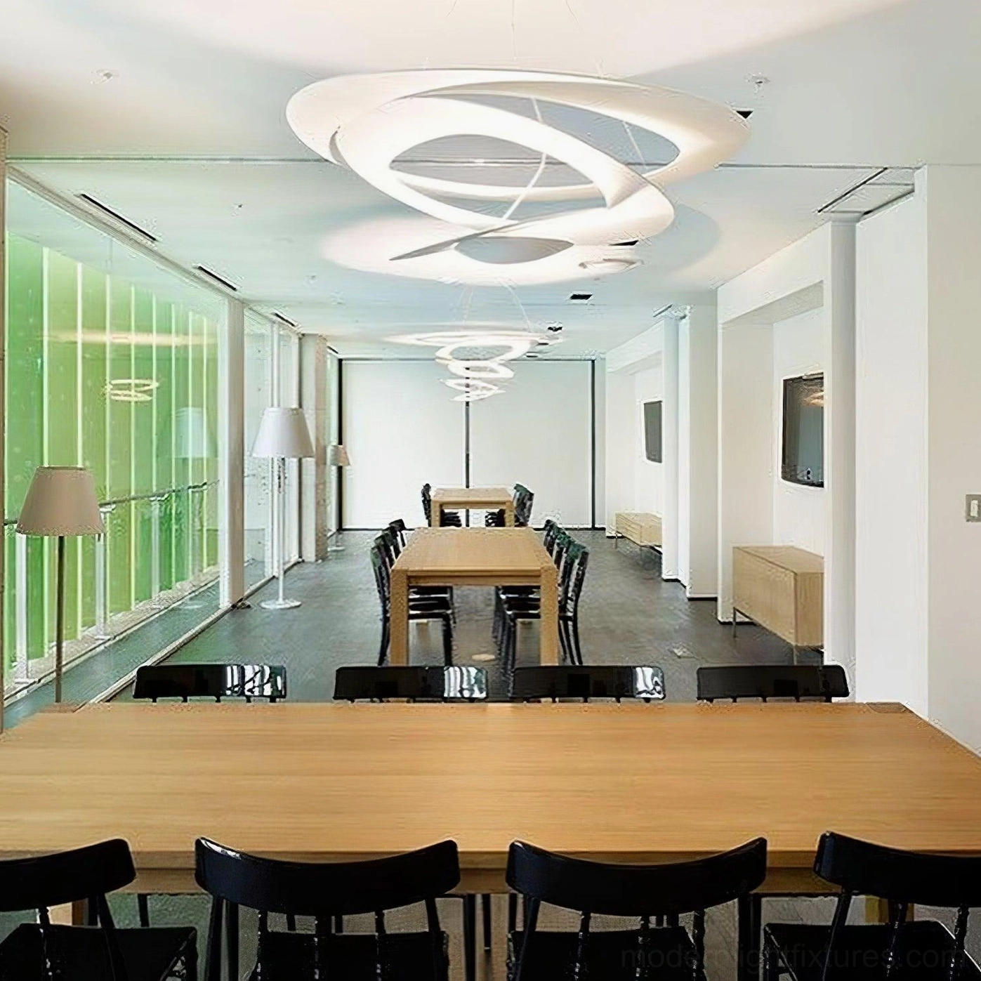 Twisted ring LED chandelier in Scandinavian interior, matte white finish with minimalist aesthetic