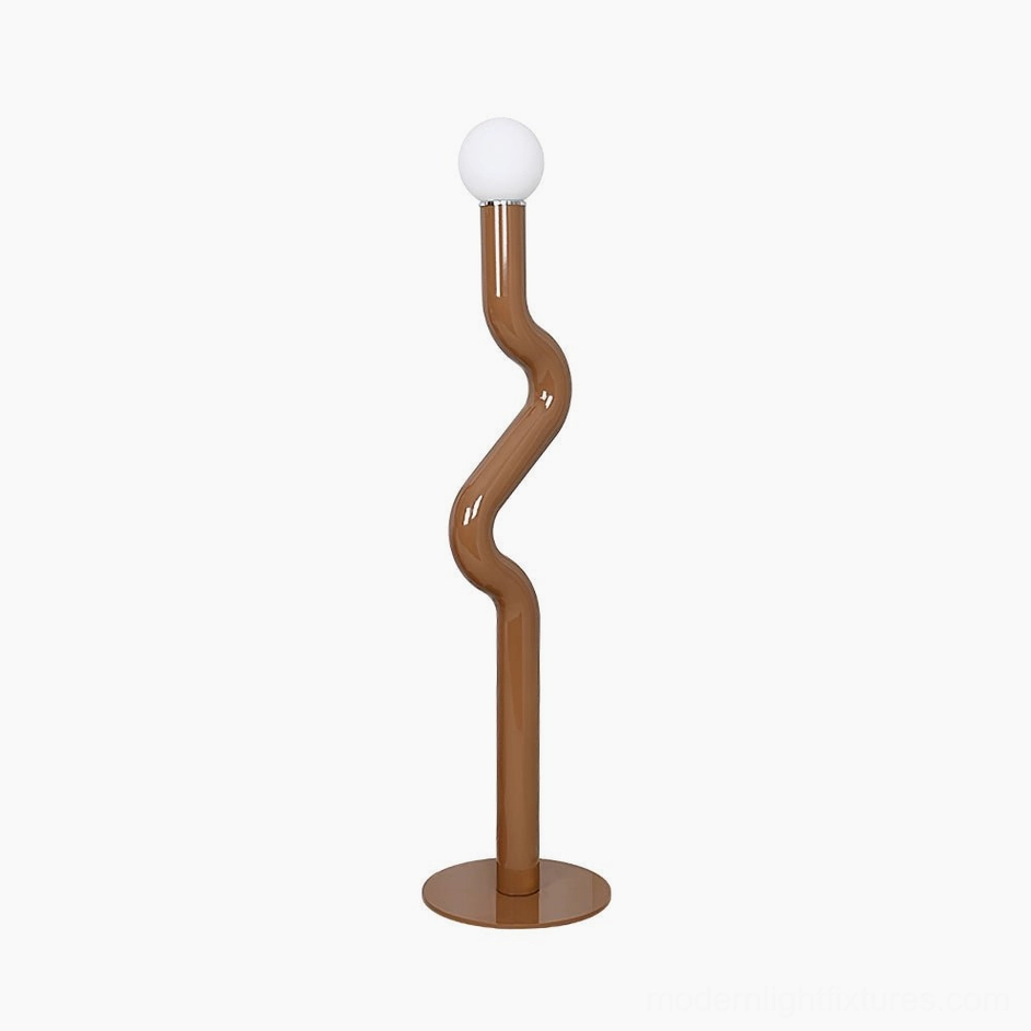Twistie floor lamp in caramel color with twisted metal pole and soft diffusing globe for warm ambient lighting