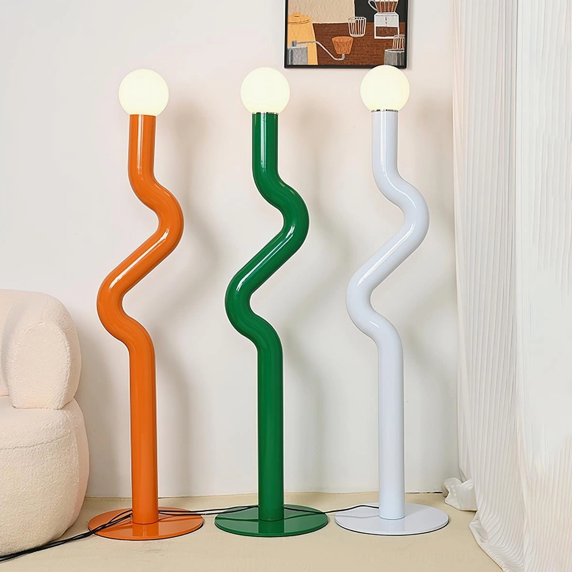 Twistie floor lamps in living room setting displaying orange and green sculptural design against sofa and curtains