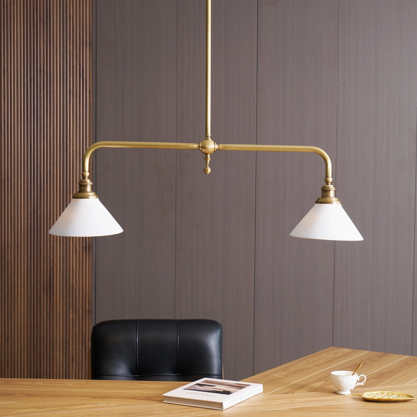 Two-head brass pendant chandelier with ceramic shades demonstrating versatile kitchen and dining room installation options