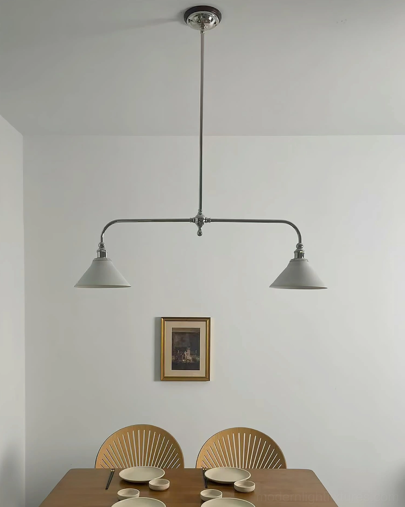 Two-light linear pendant with ceramic shades and brass metal frame showcasing mid-century modern design heritage