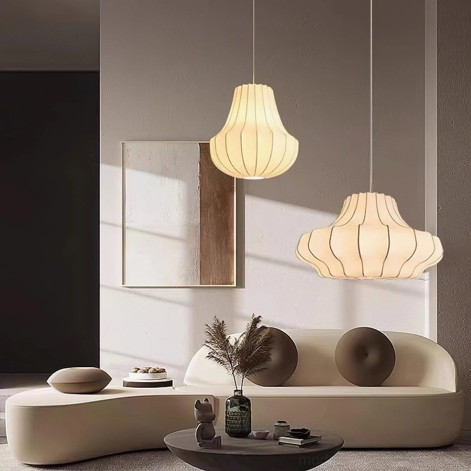 Two sizes of minimalist beige pleated pendant lamps in modern living room