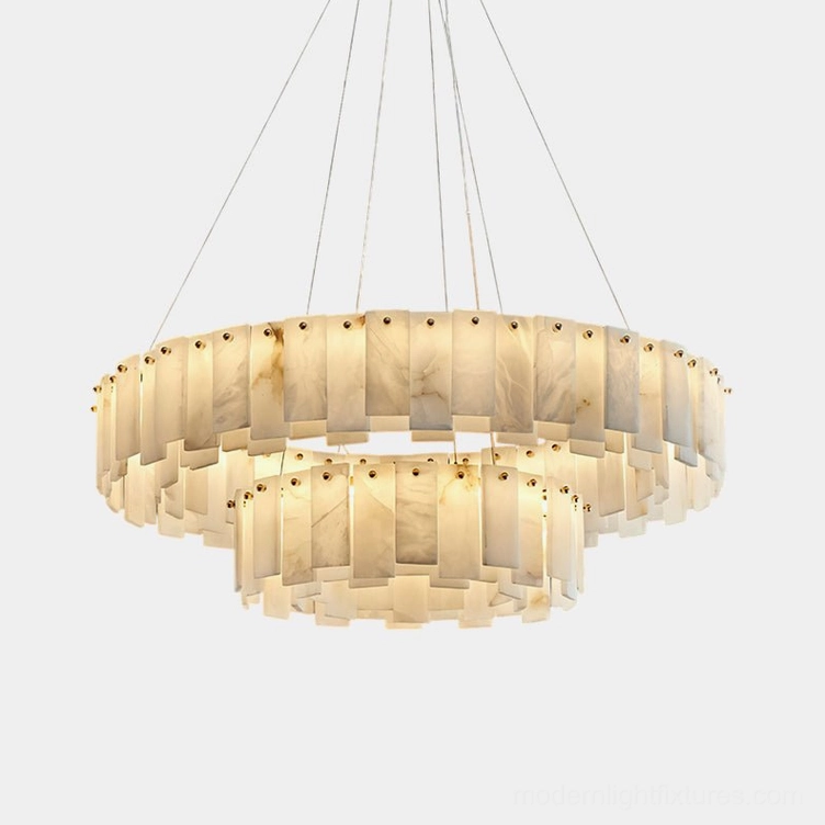 Two-tier natural alabaster chandelier with brass fixture hanging overhead, showing dual floating rings of white translucent stone with unique veining patterns
