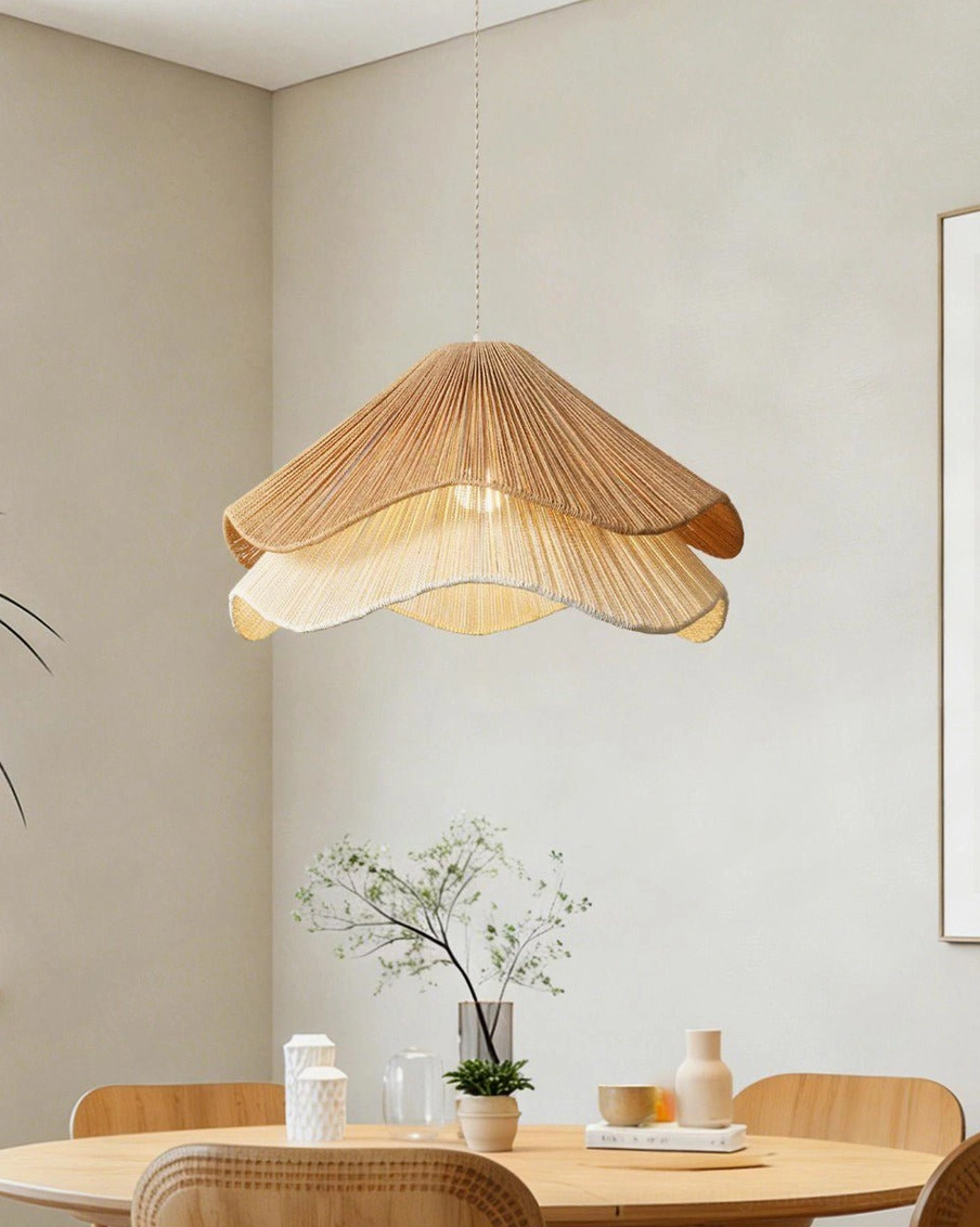 Two-tone jute-cord scalloped pendant light side view in minimalist dining nook with wooden furnishings