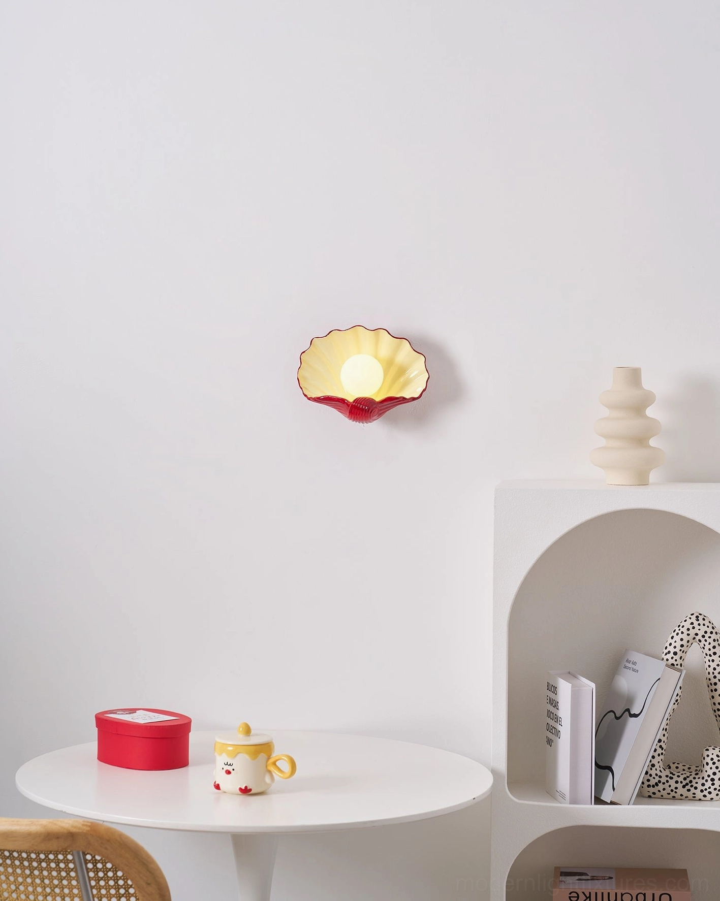 Two-tone scallop shell wall lamp detail, rippled ceramic texture and color blocking design, artistic lighting accent