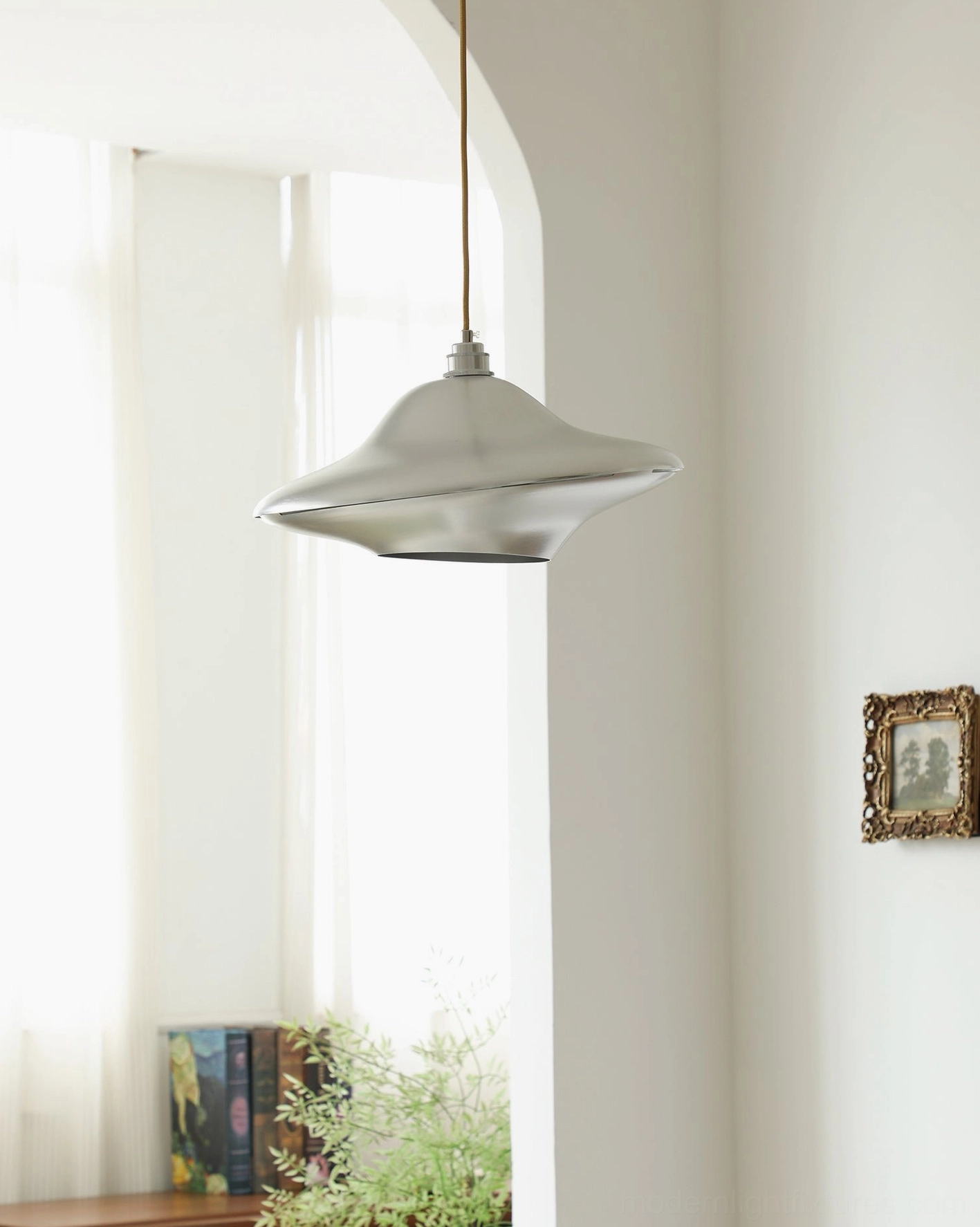 UFO ceiling lamp side view - modern pendant light fixture in vintage-inspired interior space