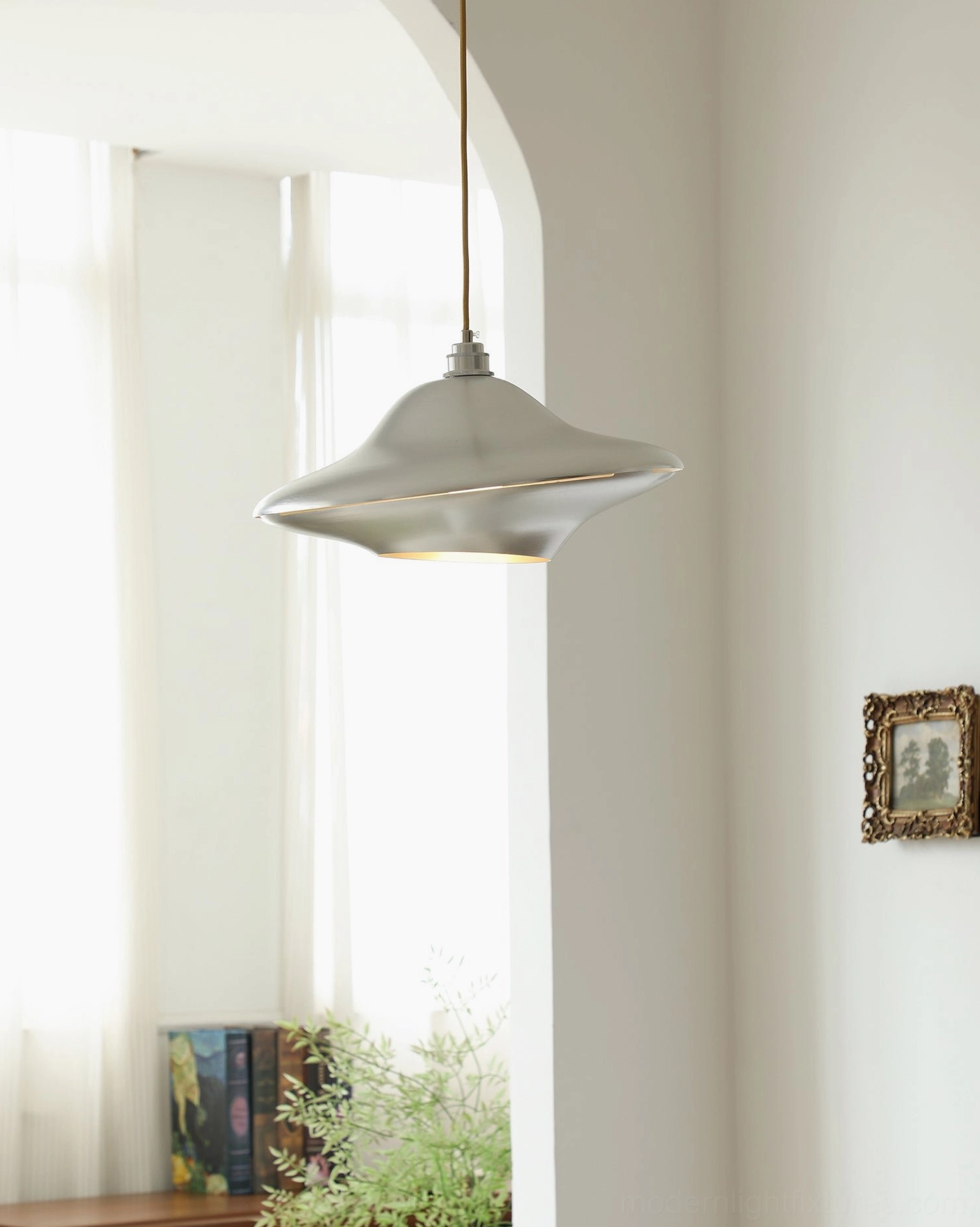 UFO pendant light in contemporary living room - space-age ceiling lamp over mid-century modern decor