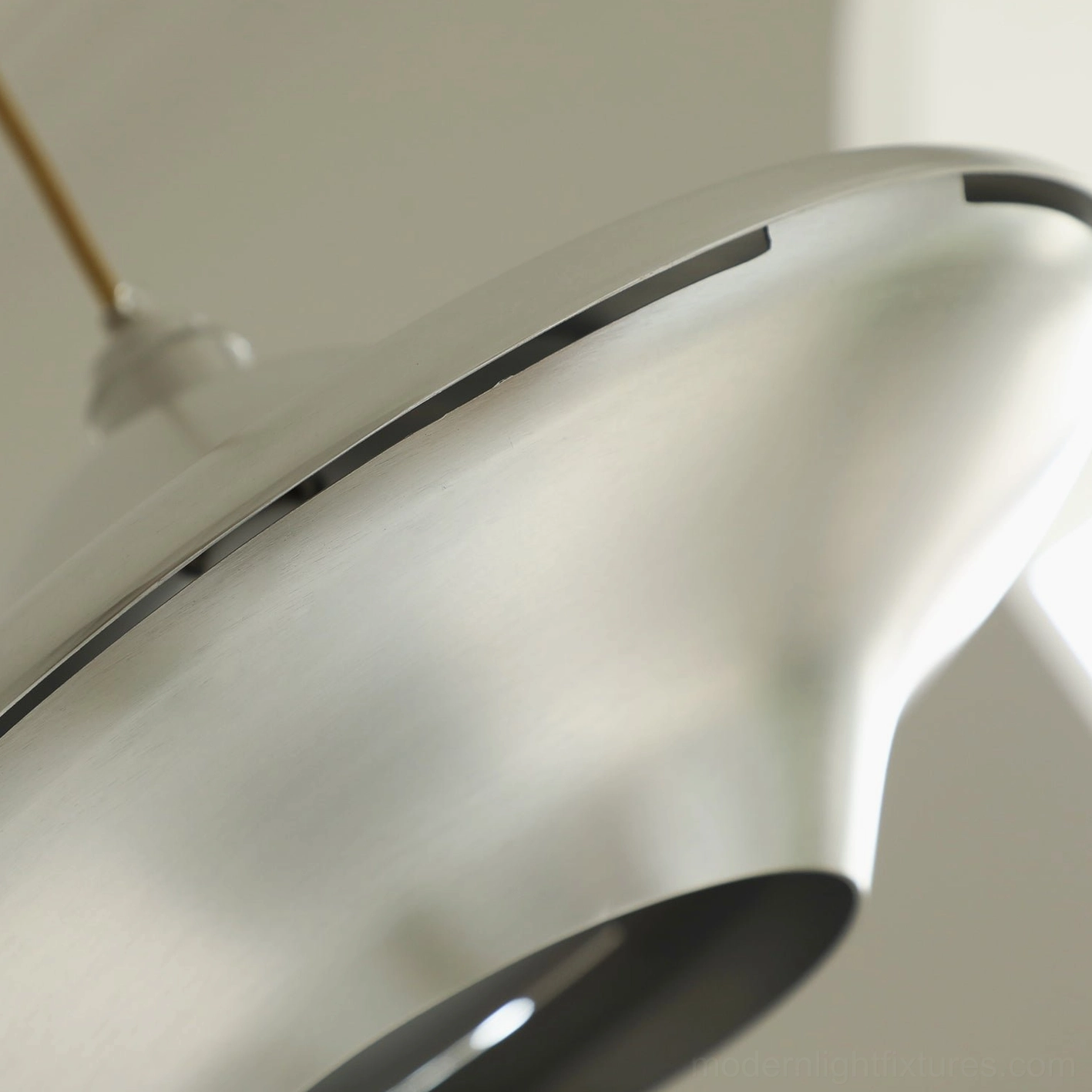 UFO pendant light in studio workspace - minimalist ceiling fixture providing focused task lighting
