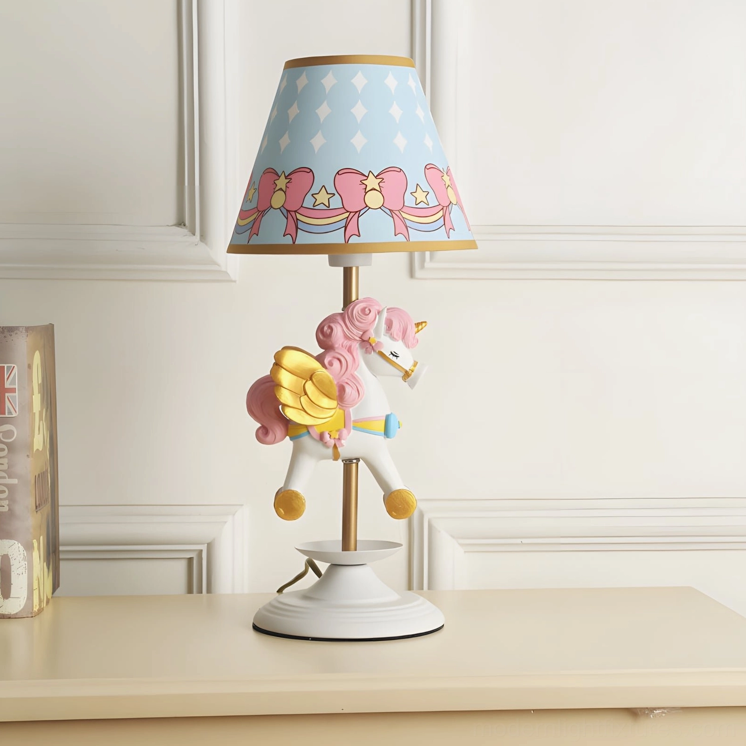 Pink unicorn carousel table lamp close-up showing metal resin body and golden accent details