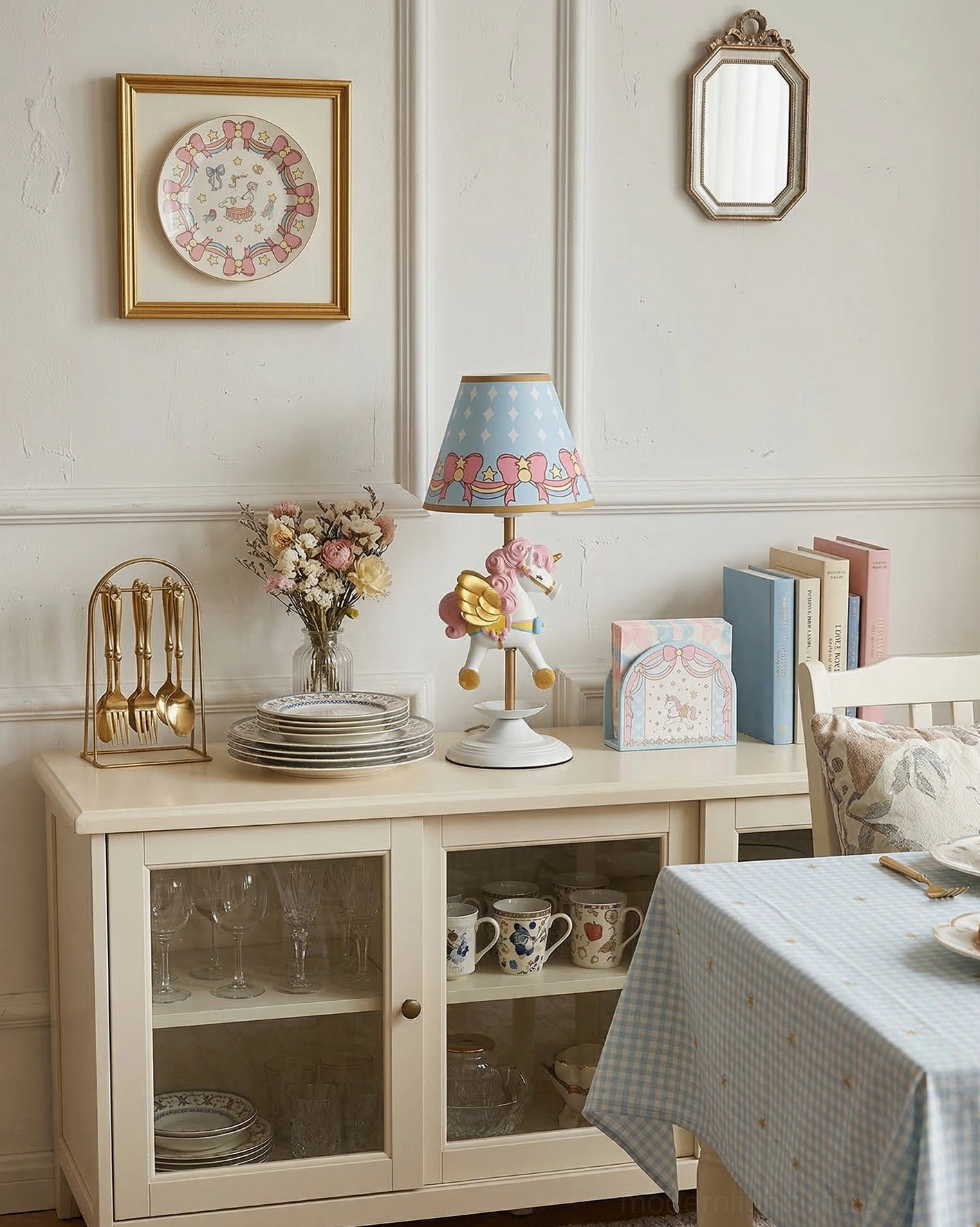 Whimsical carousel-themed table lamp on glass-fronted cabinet in French cream dining room interior design