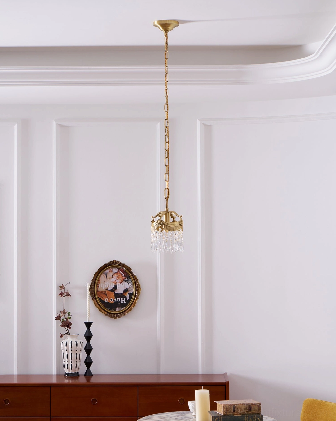 Vacarro brass pendant light fixture - warm light emission from crystal shade
