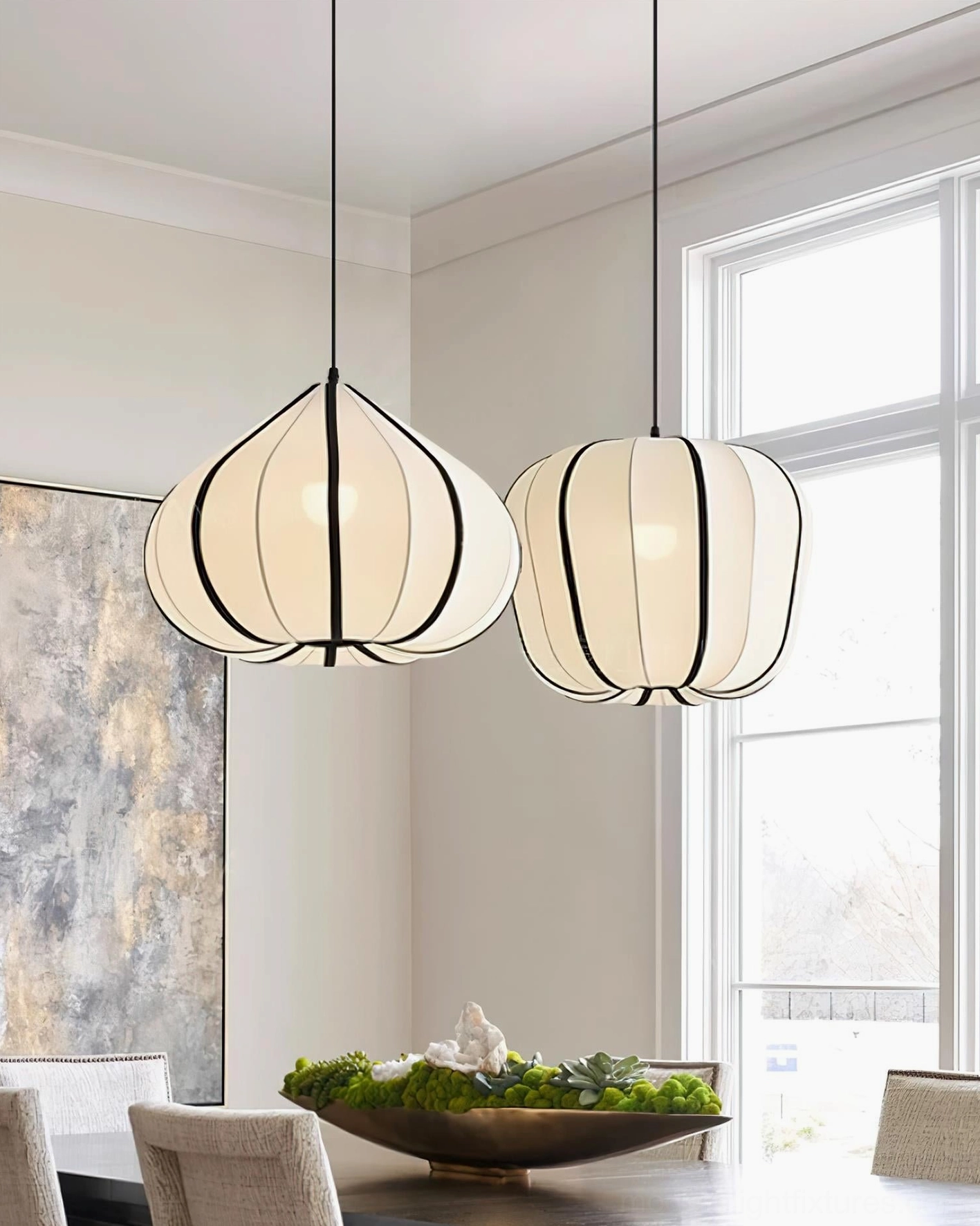 Two Valen pendant lights off-white with black trim in modern dining room with large window