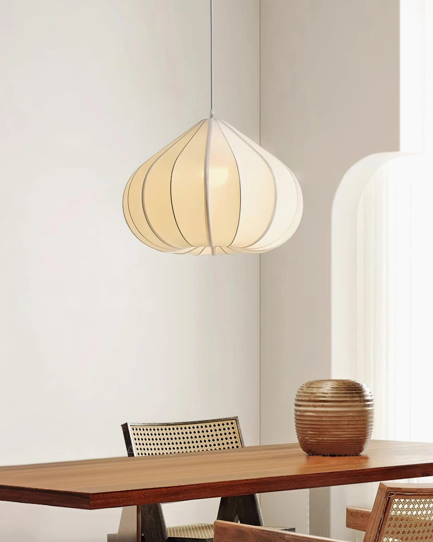 Valen teardrop pendant lamp in wabi-sabi dining room with wooden table and natural light