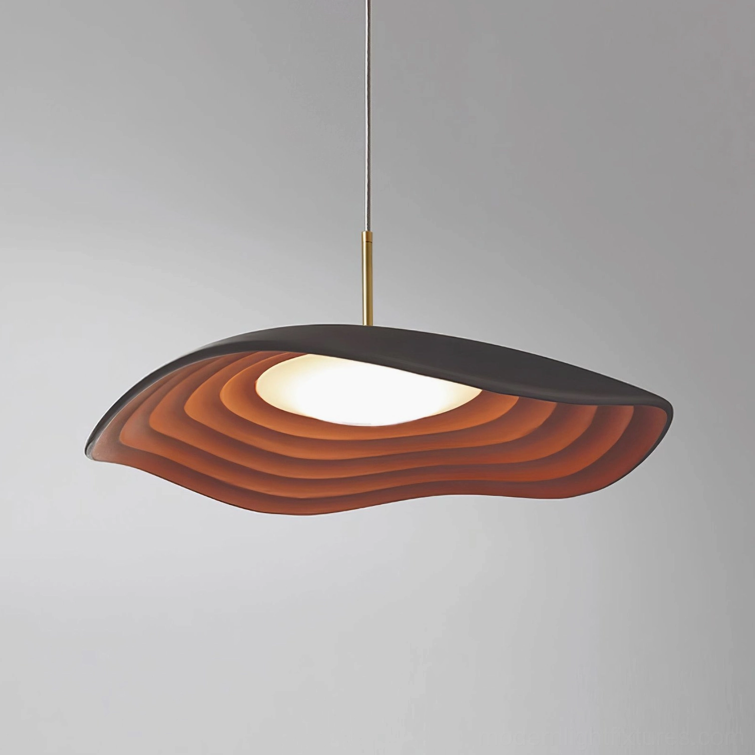 Valentina modern disc pendant light showcasing elegant wave pattern and ambient lighting dispersal design