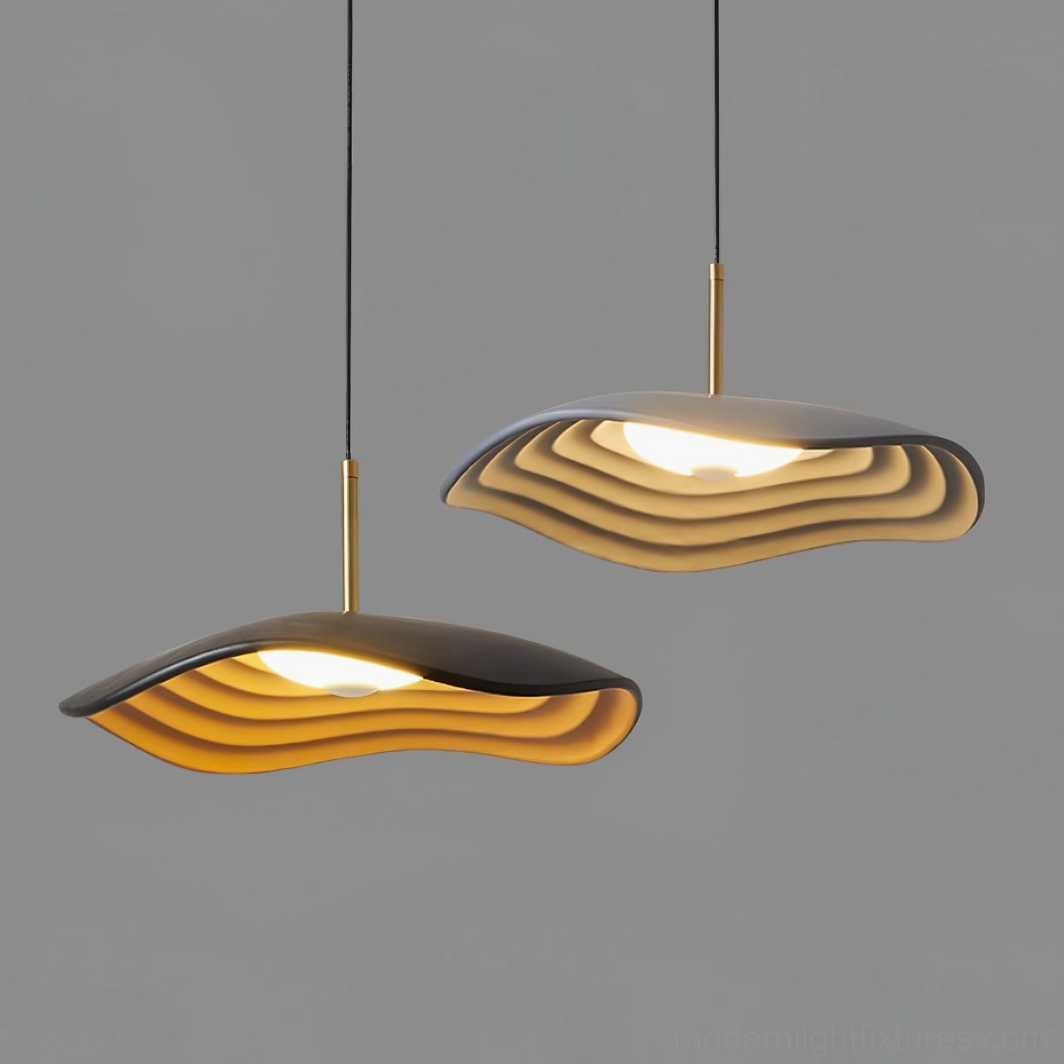 Two Valentina modern wavy pendant lights in contrasting colors with layered resin shades and brass suspension hardware