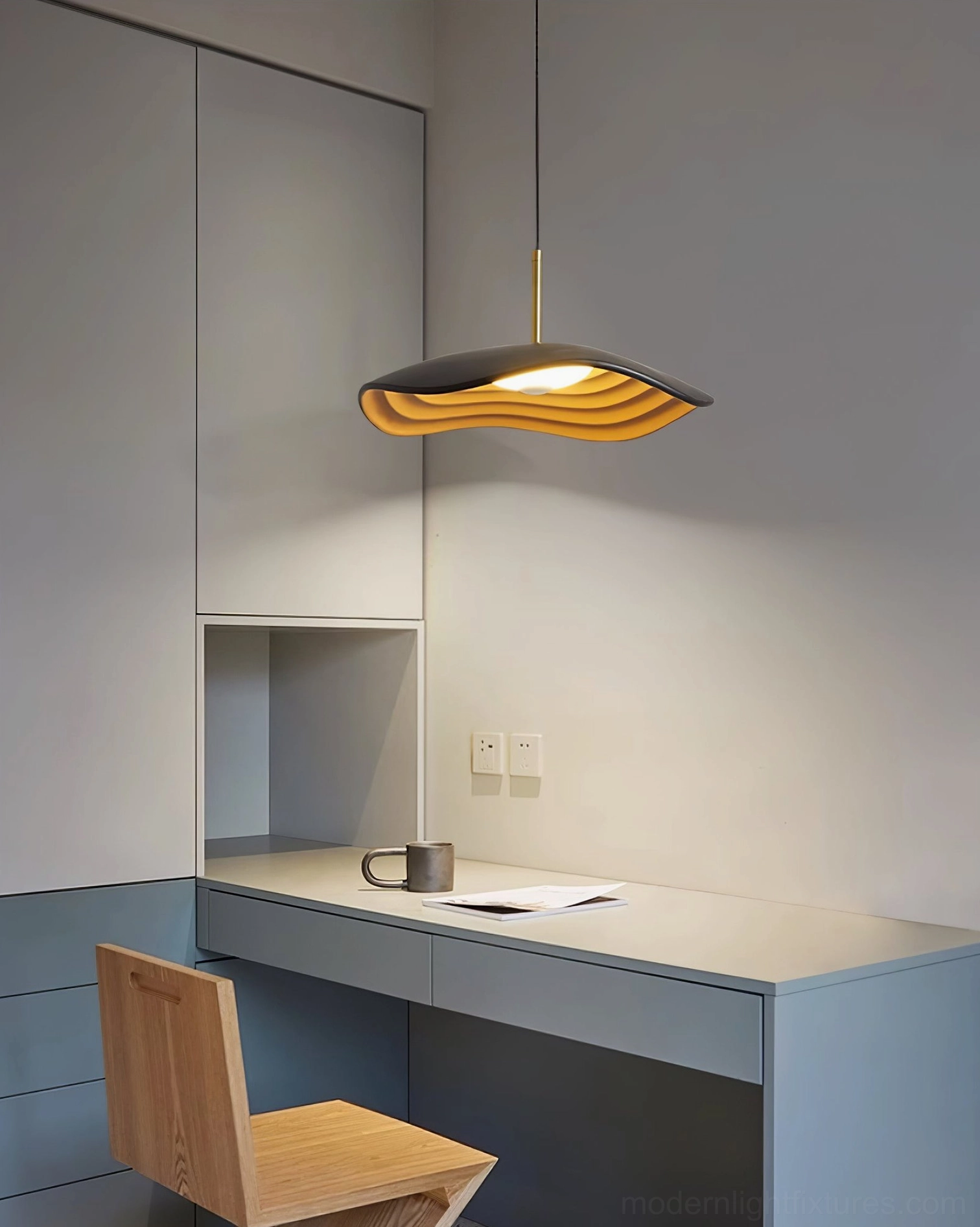 Valentina resin disc pendant light showing undulating wave pattern and layered profile design