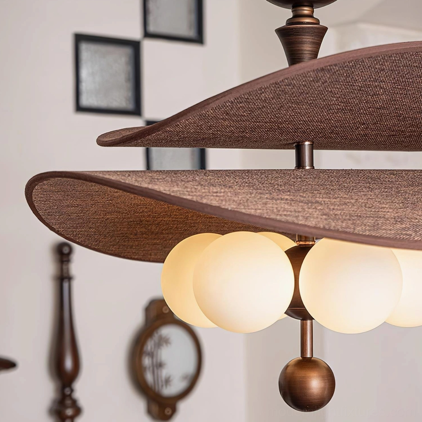 Valmorra ceiling light fixture close-up detail shot showing textured brown fabric shades, frosted glass bulbs, bronze metal hardware, vintage styling