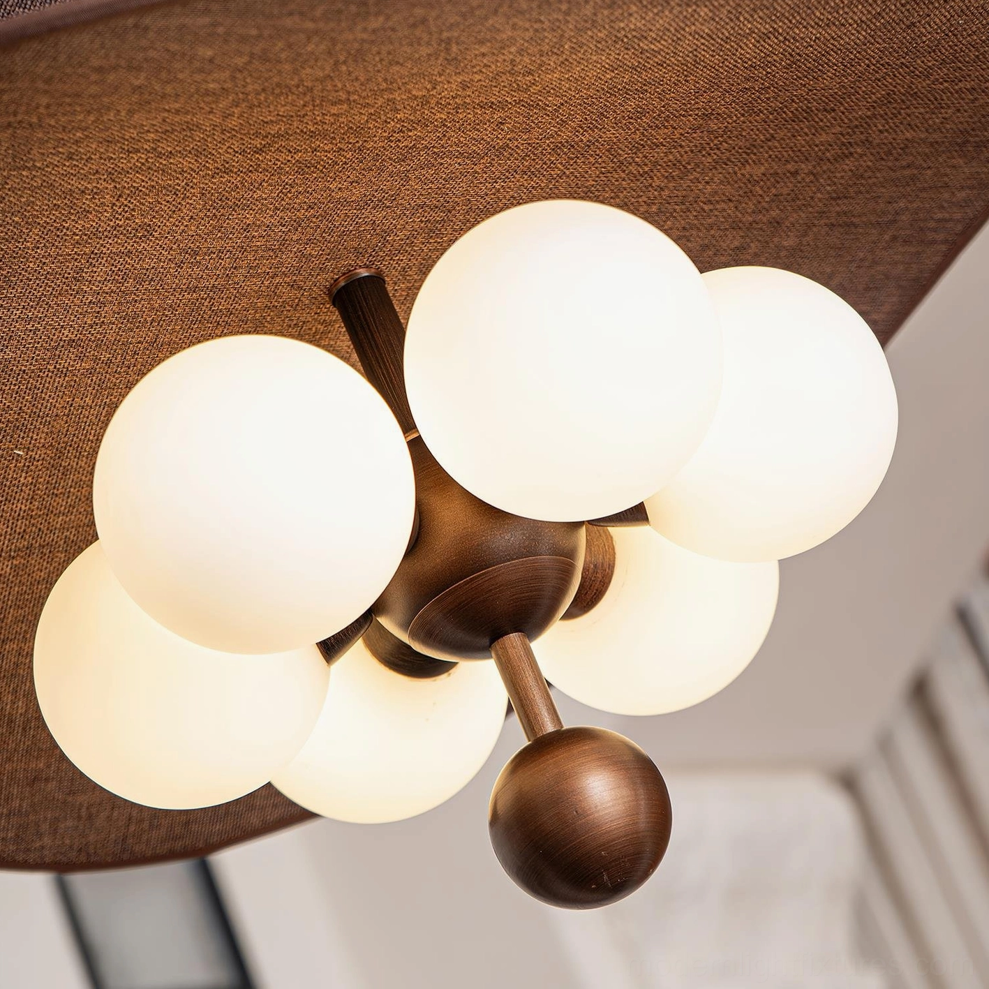 Valmorra layered fabric ceiling lamp hero shot emphasizing mid-century modern design, organic petal-like shades, frosted glass orbs, bronze metalwork