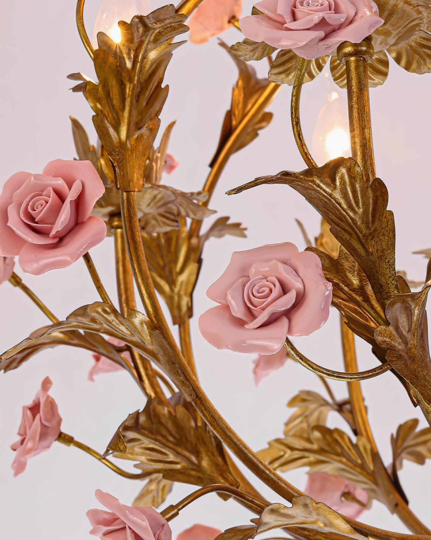 Full view of Valrosa floral chandelier installation showing complete botanical framework and candle-style light arrangement