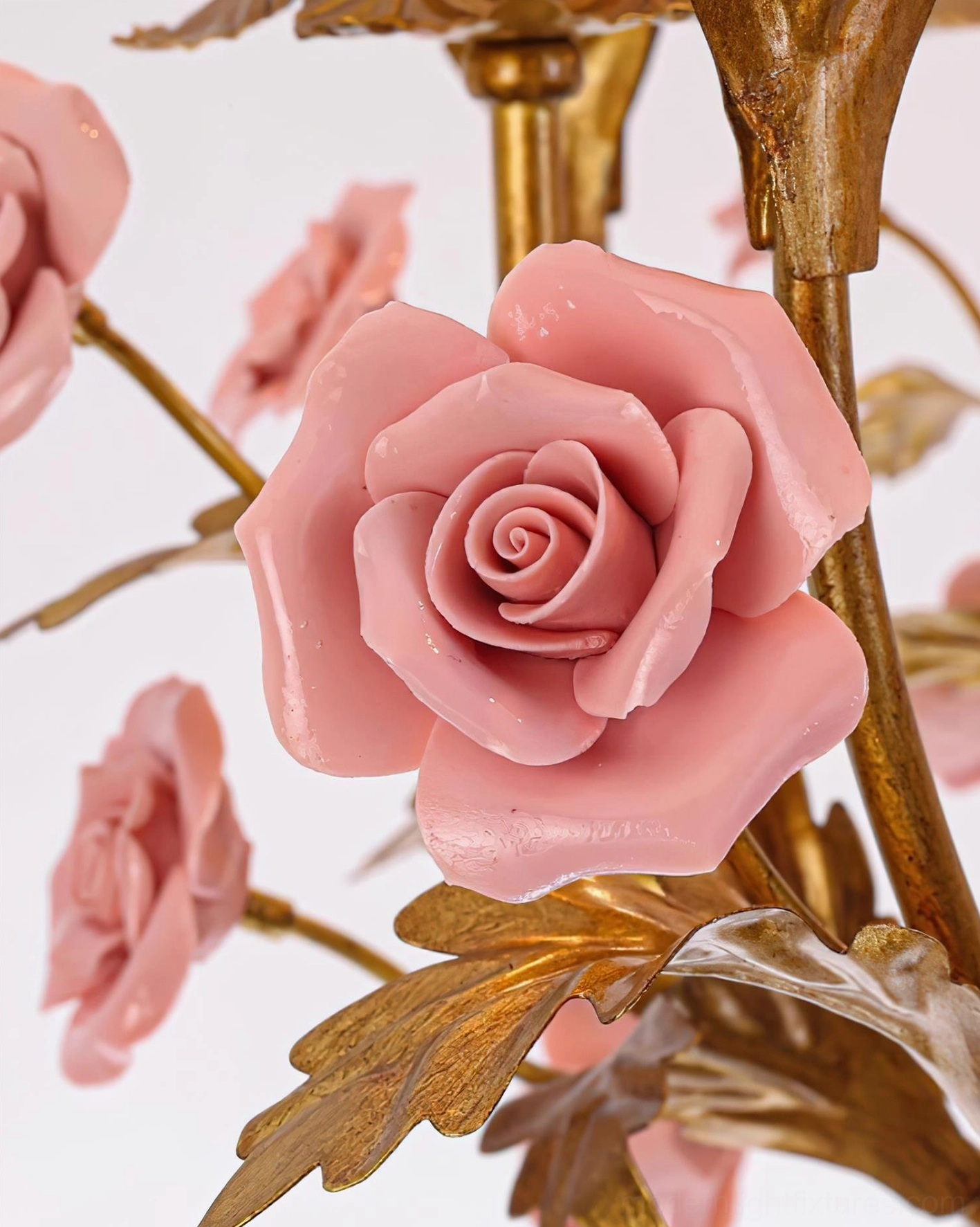 Valrosa pink and gold floral chandelier creating sculptural lighting statement in refined interior environment