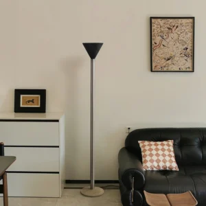 Valton black cone shade floor lamp with silver metal stem in contemporary minimalist living room