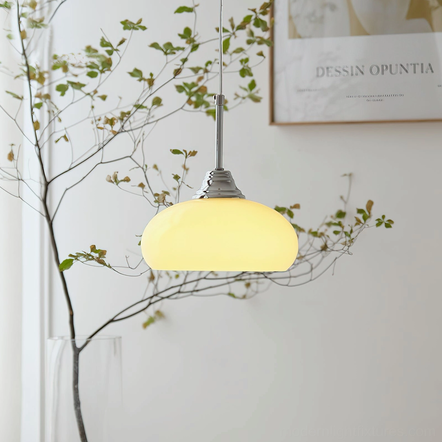 Illuminated vanilla pendant light showing warm glowing creamy glass shade in home ambiance