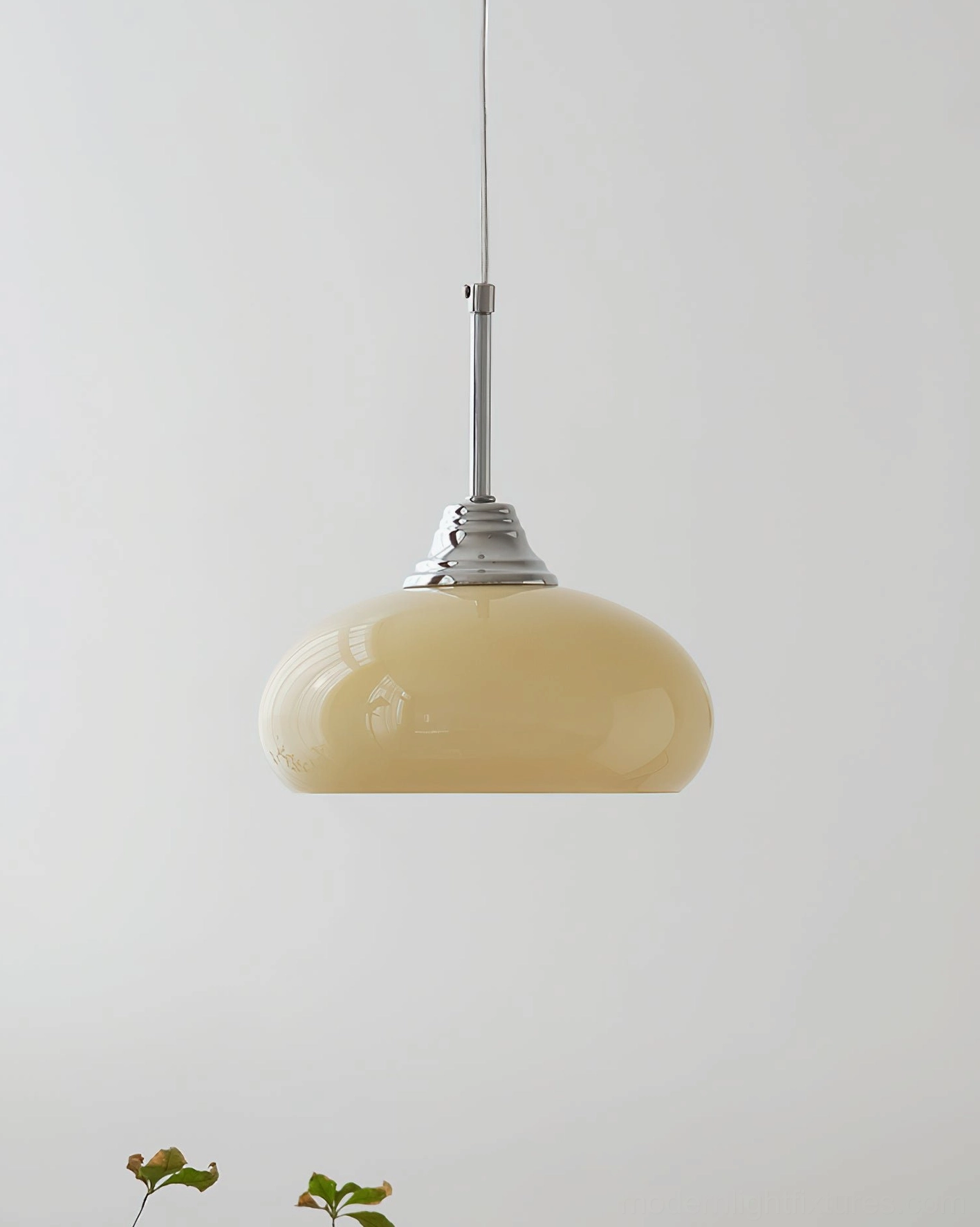 Vanilla pendant light showing smooth beige glass shade and chrome suspension rod, studio view