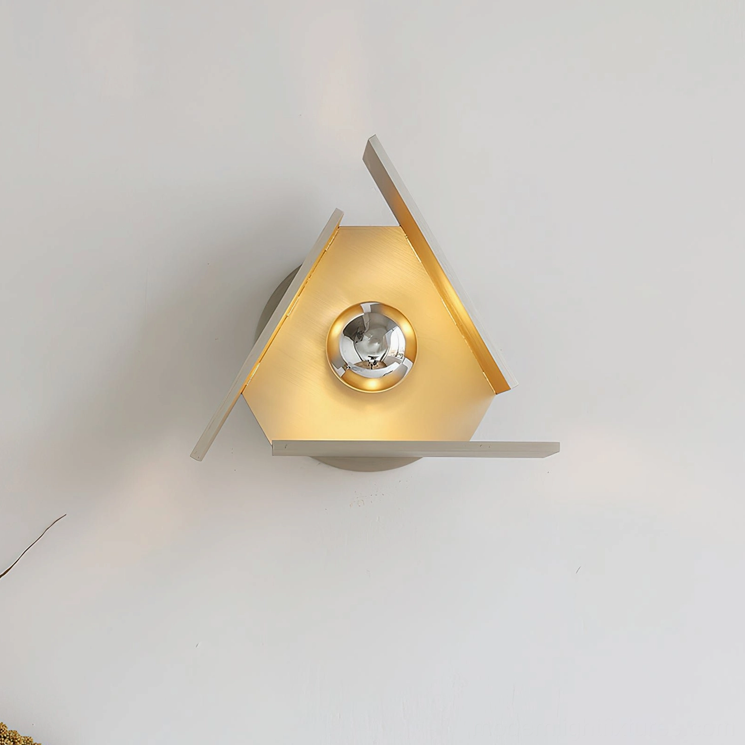 Vanta brushed silver wall sconce overhead top-down perspective revealing chrome socket and taupe-gold color design detail