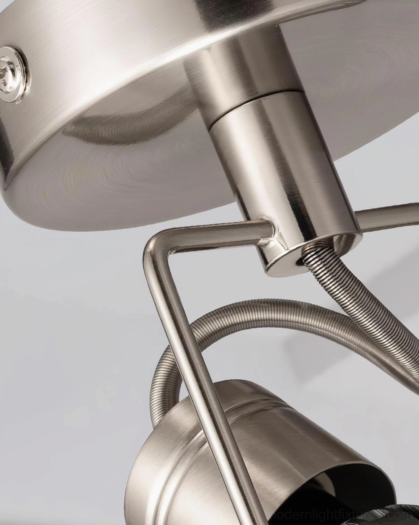 Modern ceiling track lighting with rotating spotlight heads architectural precision