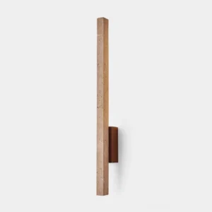 Vedra travertine wall sconce front view with warm ambient glow, modern minimalist stone lighting fixture