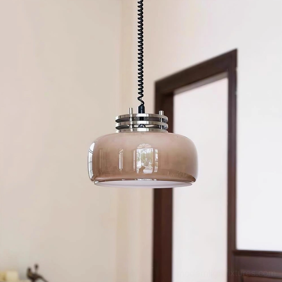 Vela vintage pendant lamp suspended in traditional hallway with dark wood trim, overhead three-quarter perspective