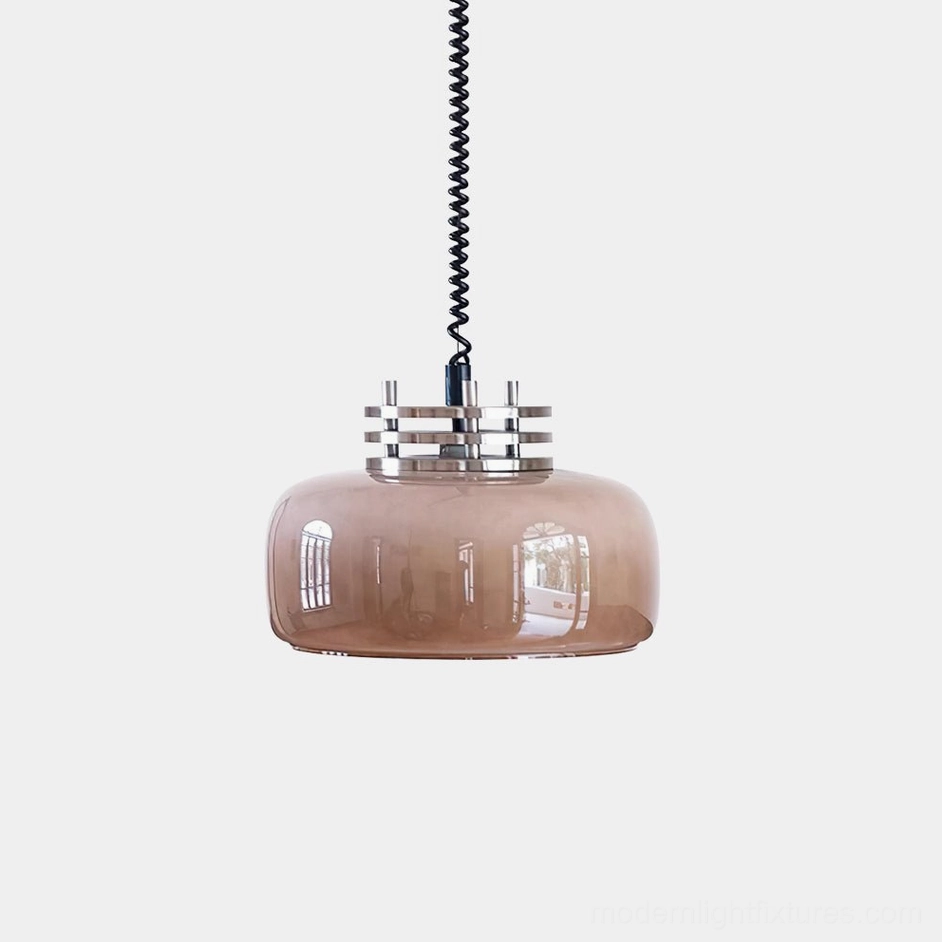 Vela pendant light with taupe brown translucent glass drum shade and polished chrome top fixture, front studio view
