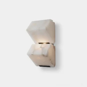 Velora alabaster wall sconce front view sculptural stacked design white studio background modern luxury lighting