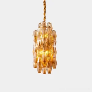 Velthra geometric faceted glass pendant light with amber glass in close-up detail view