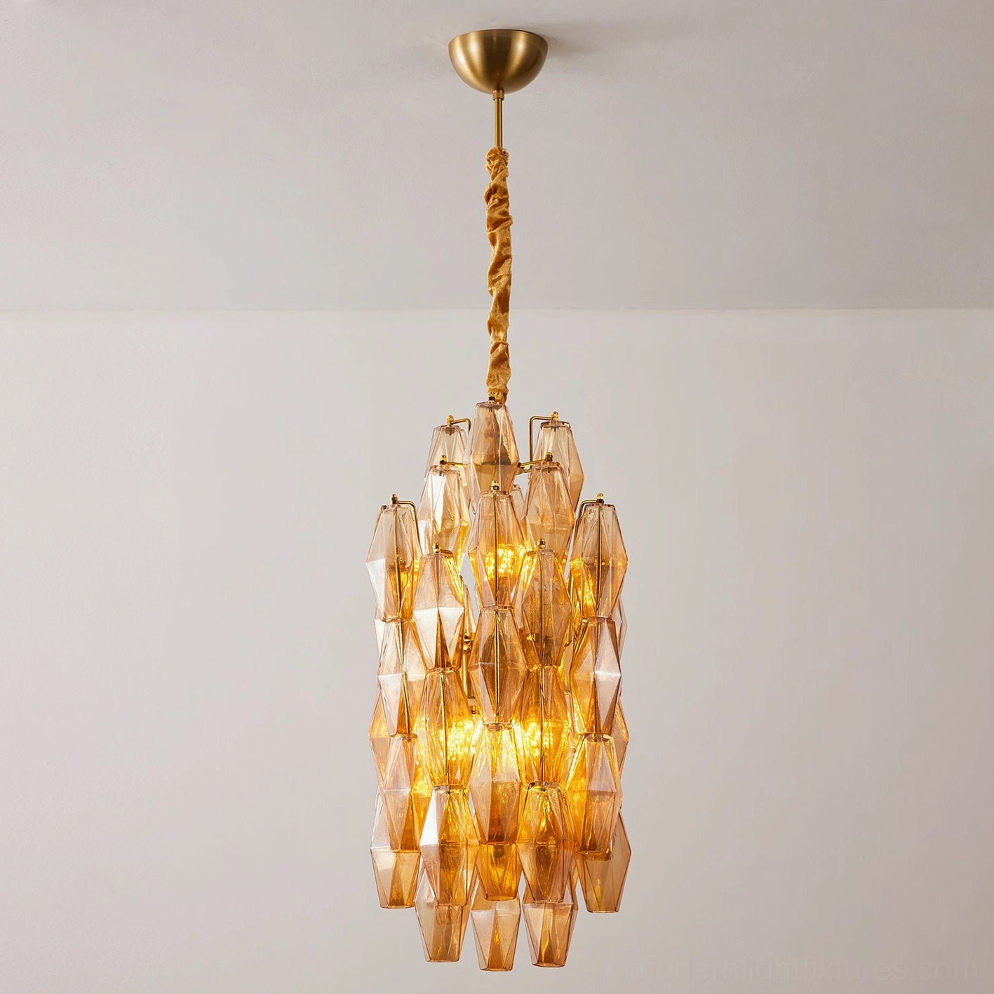 Velthra clear glass faceted pendant light with metal frame in contemporary home setting