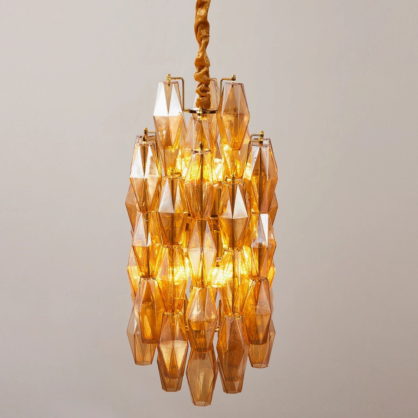 Velthra pendant light casting elegant light patterns through faceted glass design