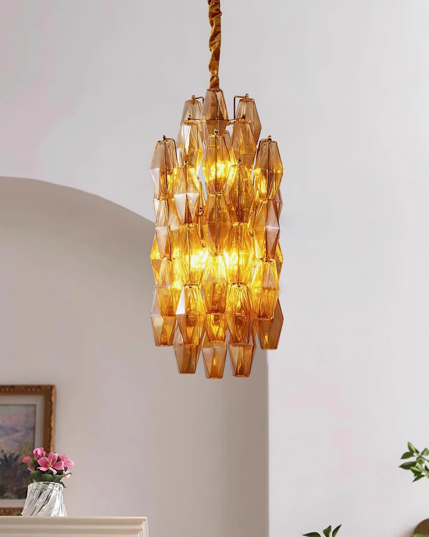 Velthra glass pendant chandelier showing geometric refraction and light pattern effect