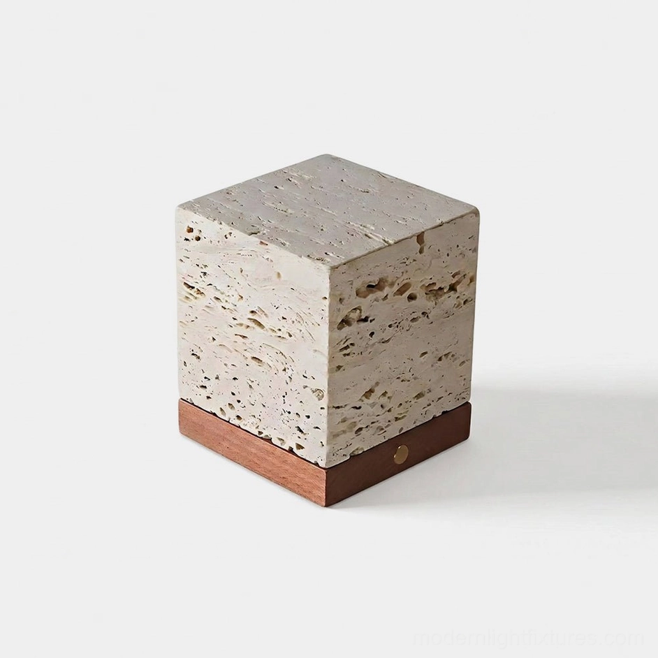 Velto travertine cube table lamp front oblique view minimalist stone lighting fixture