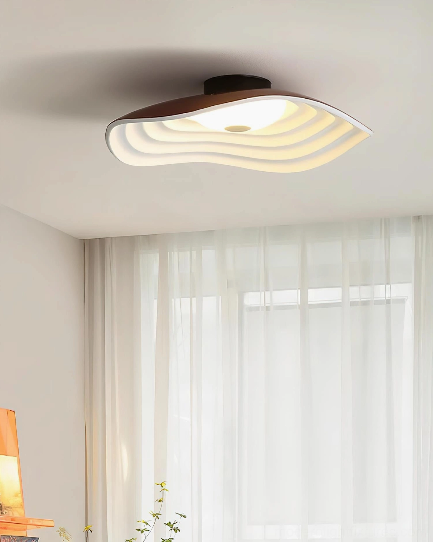 Veneria wavy flush mount ceiling light with brown frame and layered shade providing warm ambient illumination in bright living room