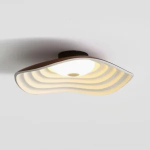 Veneria ceiling light fixture angled overhead view showing curved layered diffuser and dark ceiling base with warm interior lighting
