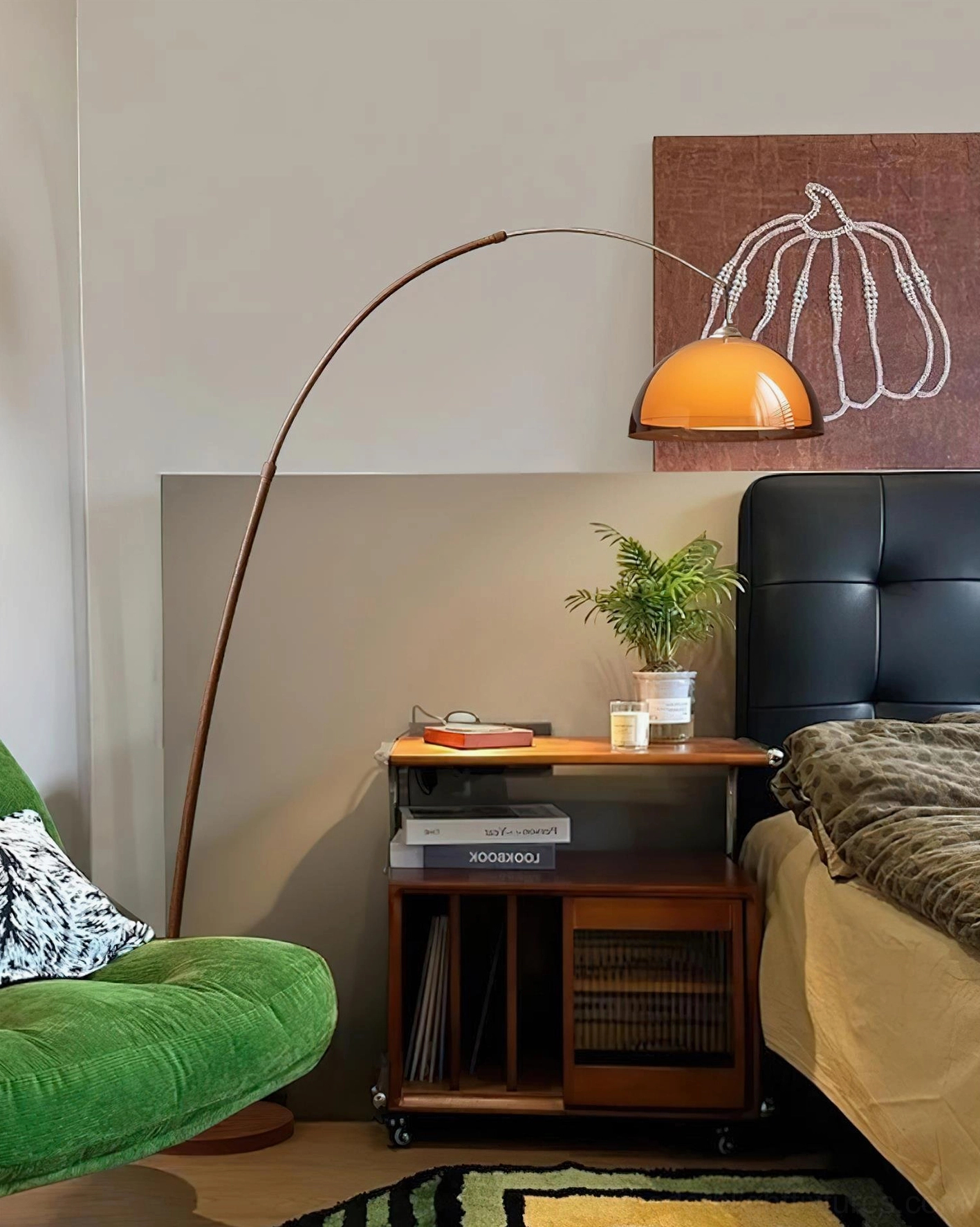 Ventoro floor lamp with brown metal pole and amber dome shade beside bed with wooden nightstand, warm cozy bedroom lighting