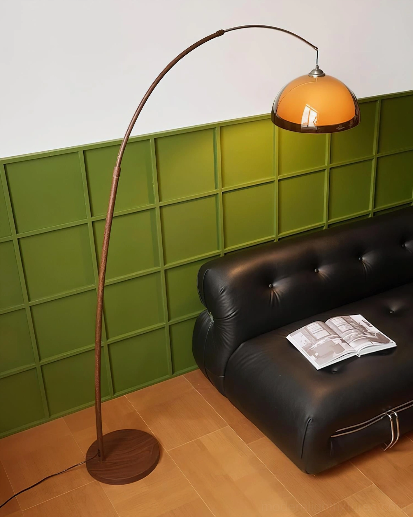 Ventoro floor lamp eye-level side view beside leather sofa, minimalist retro style with dark brown pole and warm amber shade